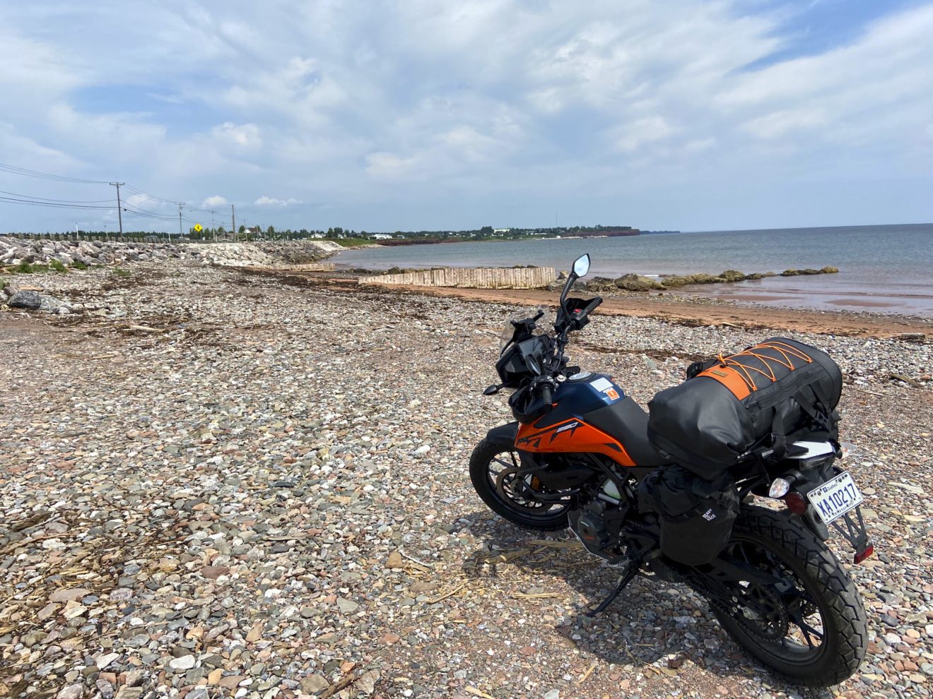 a motorcycle parked on the beach in gaspésie