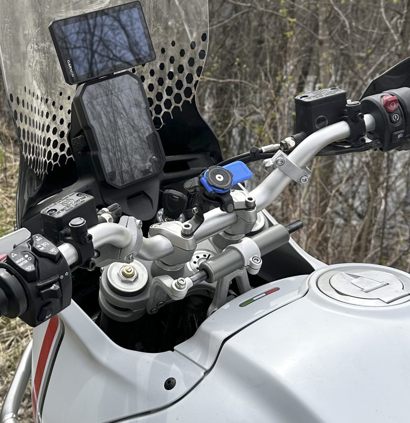 The original cockpit of the Ducati Desert X is much more visually cluttered.